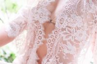 12 a sexy short sheer lace bridal robe with half sleeves and nude lingerie under it is a great idea to make some shots for the groom