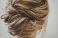 12 twisted braided updo with a cool texture and a small hairpiece on the side