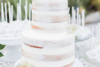 13 The wedding cake was a naked one with florals and a calligraphy topper