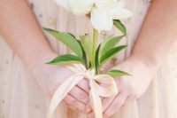 14 a single stem white bloom will stand out if you are wearing a colored wedding dress
