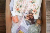 16 a simple box with a candle, some tequila, bold polish and a photo for a colorful wedding
