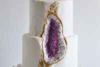 18 a marbleized wedding cake with amethyst and gold leaf decor and a sugar geode on top