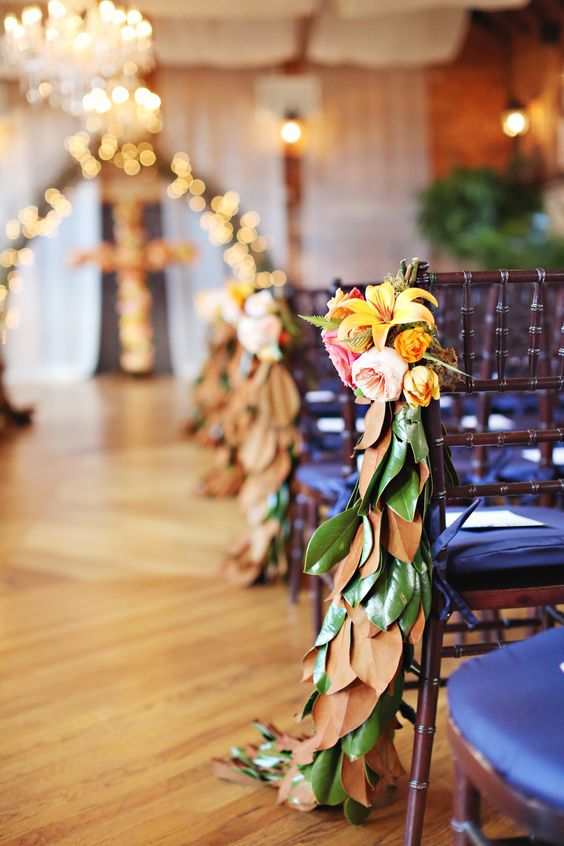 magnolia leaf, lilies and penoy posies for decorating the aisle