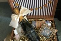 19 a glam box with champagne, nail polish, cookies, a photo and confetti