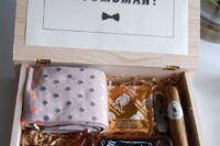 19 a simple box with a bottle of whiskey, a cigar, socks, a bottle opener and a condom
