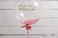 20 a cute personalized balloon filled with pink paper hearts and a thread of them