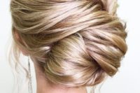 20 a twisted large low bun is a very chic option, which will easily fit a more formal look