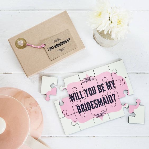 a cute pink 'Will You Be My Bridesmaid' jigsaw with a matching envelope