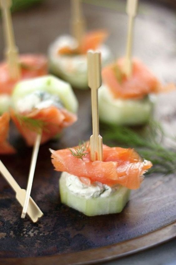 fresh cucumber slice plus cream cheese and salmon is a tasty appetizer idea for any season