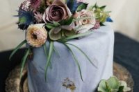 23 a moody marbleized slate grey wedding cake with moody florals, thistles and air plants