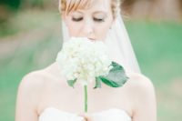 23 a single stem white hydrangea wedding bouquet is a cute idea with a rustic feel