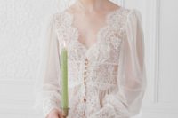 23 a vintage-inspired off-white bridal robe with a lace bodice, lace trim and sleeves and puff sleeves