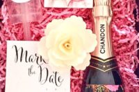 24 a glam box with a watercolor, confetti, a calendar, a soap flower and a labeled bottle of champagne
