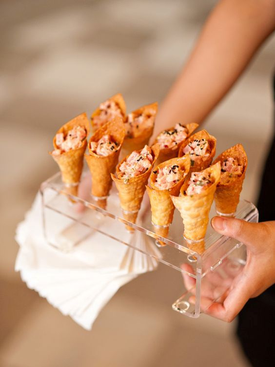 spicy tuna served in wonton ice cream cones with toasted black sesame seeds is a creative idea