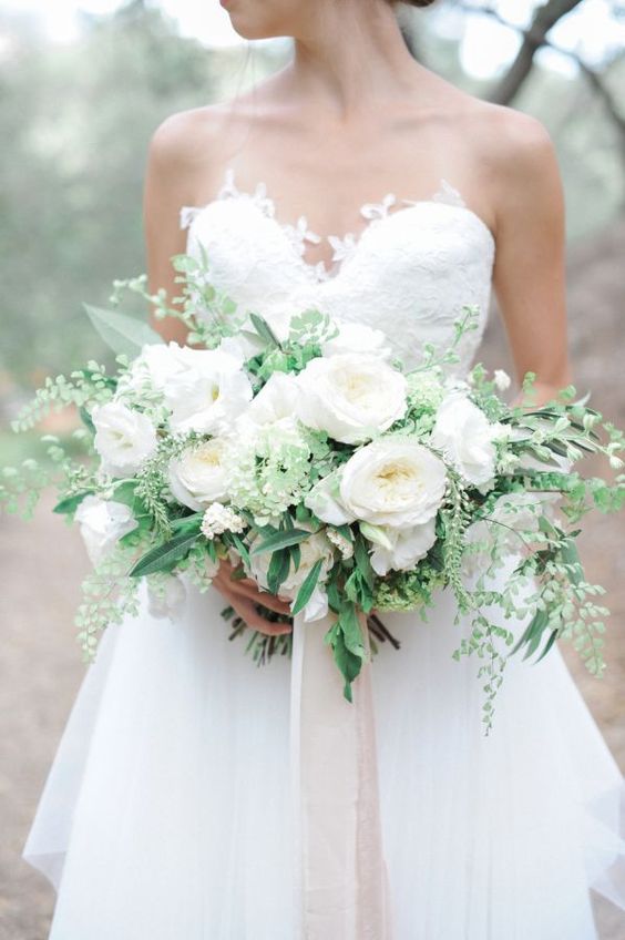 a large elegant white peony and greenery bouquet for a bride who loves classics