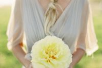 26 a single yellow bloom that stands out with a dove grey bridesmaid’s dress