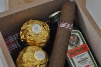 26 a small box with chocolate, a cigar and a mini bottle of alcohol for a rustic-inspired wedding