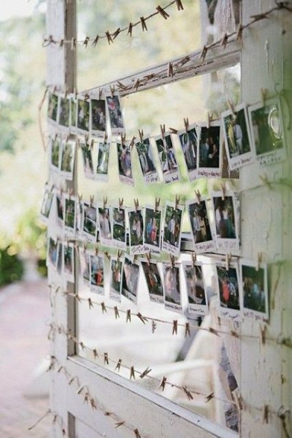 a wedding guest book with Polaroids to write wishes on them
