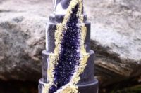 27 marbleized purple wedding cake with amethyst and gold decor and a piee of geode on top