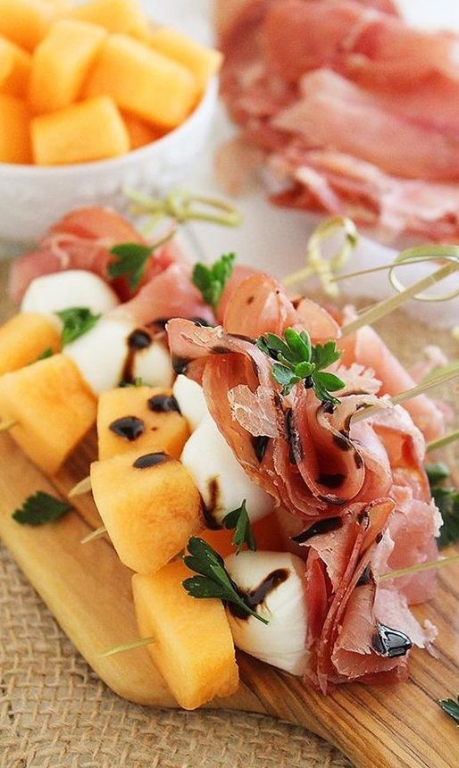 sweet and salty skewers with prosciutto, melon and creamy mozzarella drizzled with balsamic