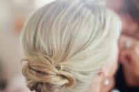 a chic textured low bun with a volume on top is a lovely idea for a wedding, it looks stylish and is easy to make