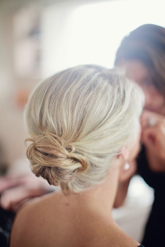 a chic textured low bun with a volume on top is a lovely idea for a wedding, it looks stylish and is easy to make