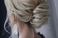 a classic and very elegant low chignon updo with a volume on top and some locks down is very chic