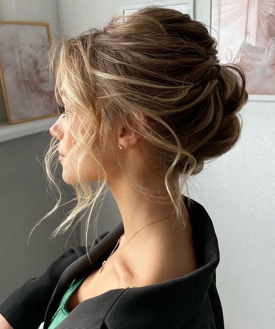 a dimensional and messy wavy updo with a bump on top and some waves down is a lovely idea for a wedding