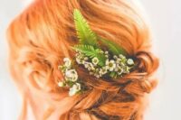 a ginger red tight low updo with a bit of volume on top, some locks down and some blooms and fern is a lovely idea for a boho wedding