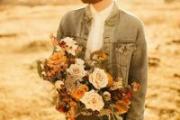 a relaxed groom’s outfit with a white shirt, grey pants, a bleached denim jacket and sunglasses is a lovely and cool idea