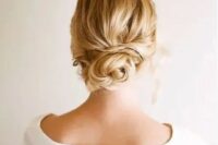 a simple twisted low bun is suitable for long and medium length hair