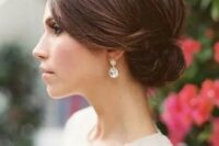 a sleek top and a small side low bun for a timelessly elegant look is suitable for medium and even short hair