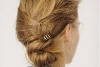 a super messy and textured twisted low bun is a fast solution to make on the go