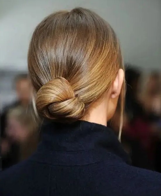 a very sleek twisted low bun with no hairpieces for a chic ultra-minimalist look