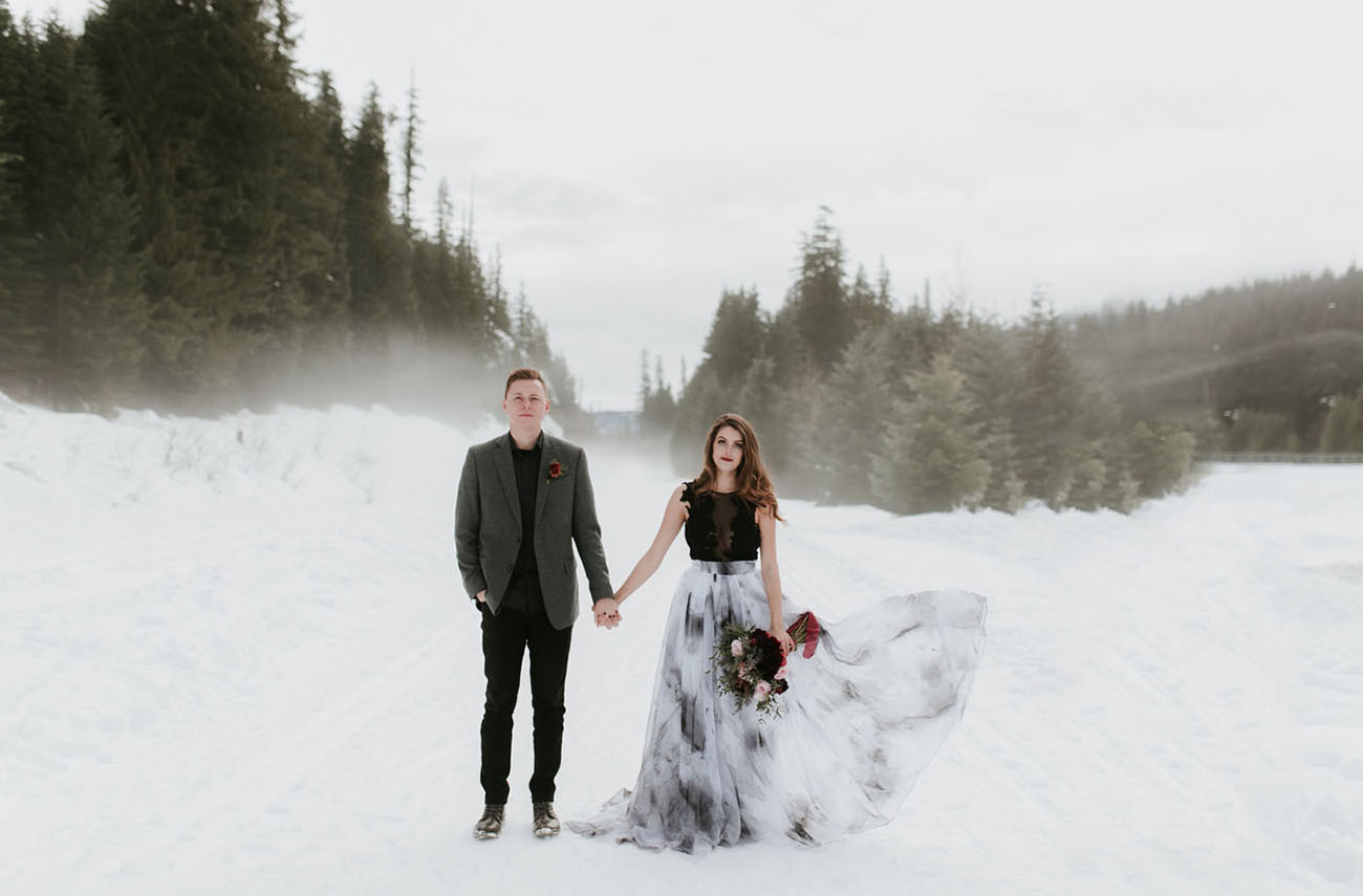 This gorgeous wedding shoot took place in the snowy mountains, and the contrast between dark colors and snow is striking