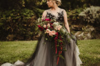 02 The bride was wearing a unique dress with an overlay, black lace on the bodice