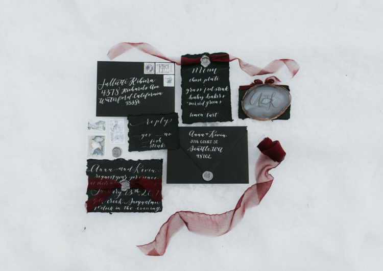 The wedding stationery was done in black and white, with a raw edge and burgundy ribbons