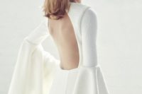 02 a modern wedding dress with bell sleeves and a cutout back