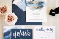 navy wedding stationery with gold and white calligraphy and glitter and watercolor touches