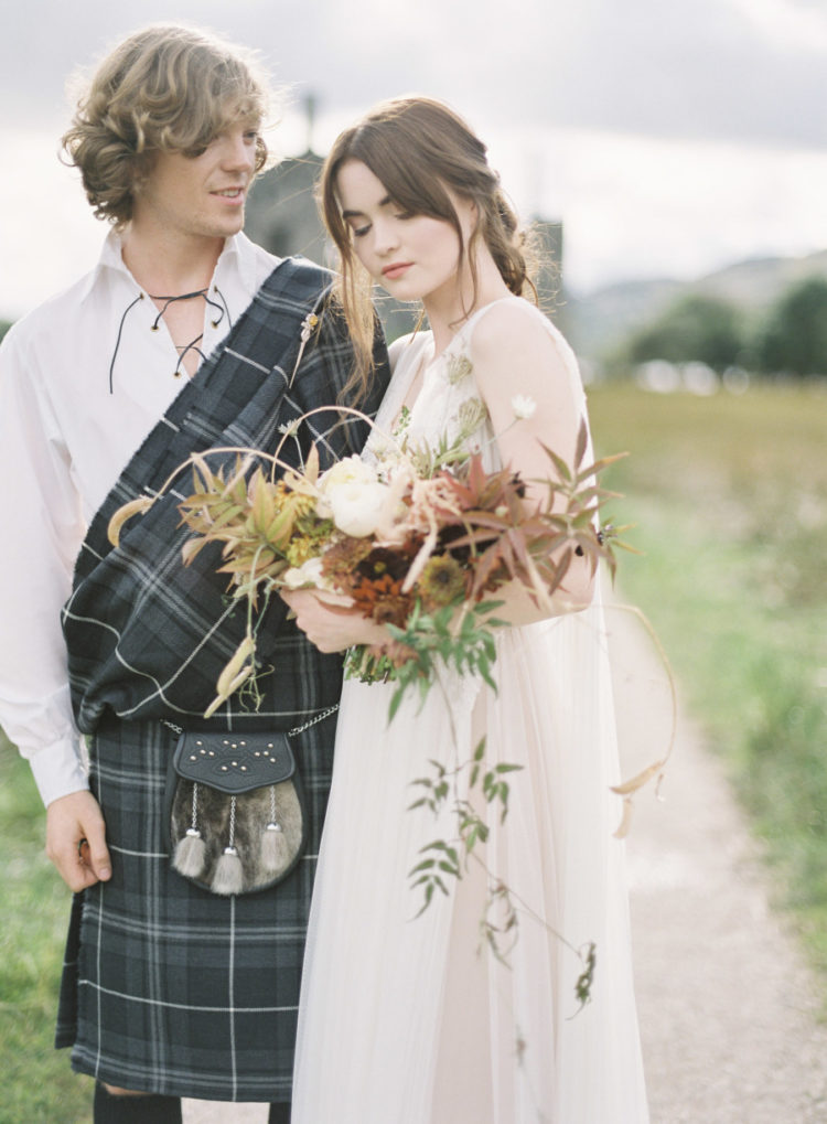 The groom opted for a white shirt with lacing and a traditional kilt