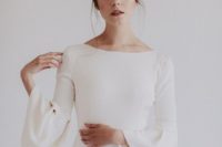 03 a modern sheath bell sleeve wedding dress with a bateau neckline for a minimalist wedding