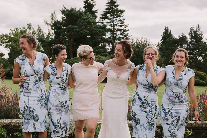 The bridesmaids were wearing midi floral dresses with V necklines