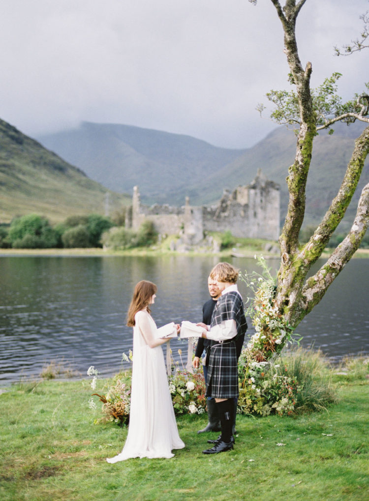 The ceremony took place at a nearby tree, which was styled with moody florals for the shoot