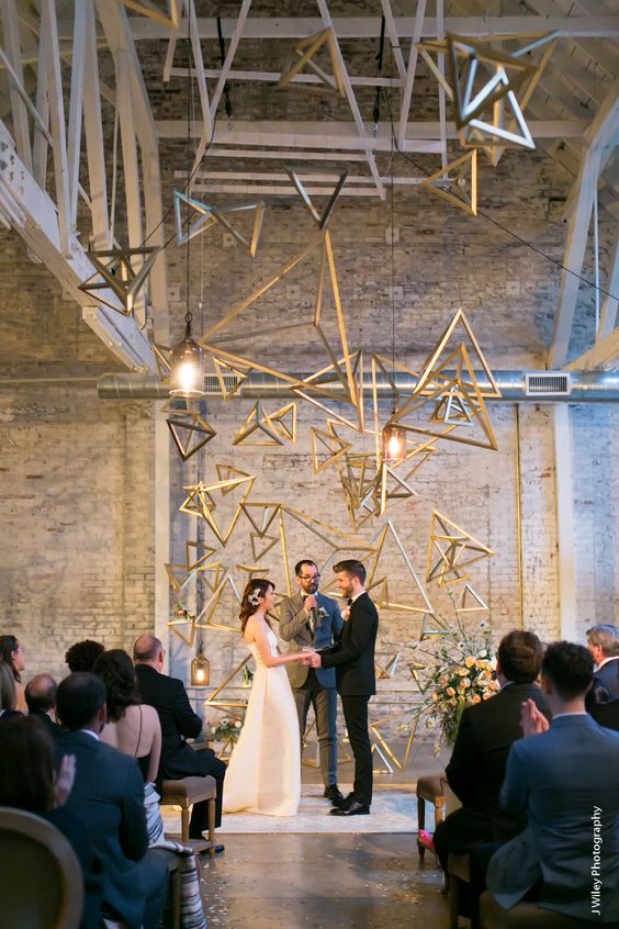 a stylish 3D triangle geometric backdrop with some lights for a statement look