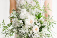 05 The bride’s oversized textural bouquet perfectly matched the wedding arch