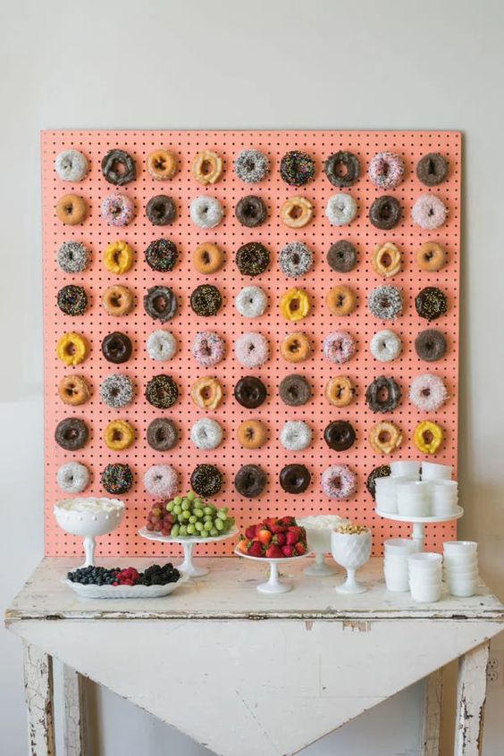 a pegboard is always a great idea because you can attach hooks to it and hang donuts on them