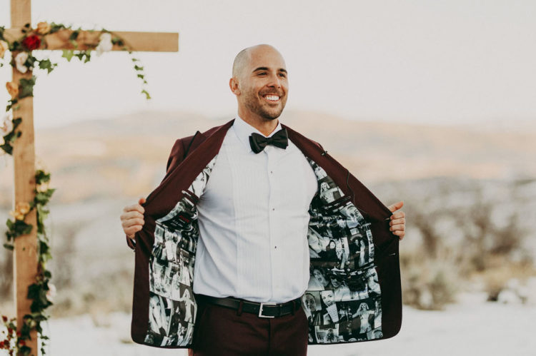 The groom was wearing a burgundy suit with photo lining, which is very cute