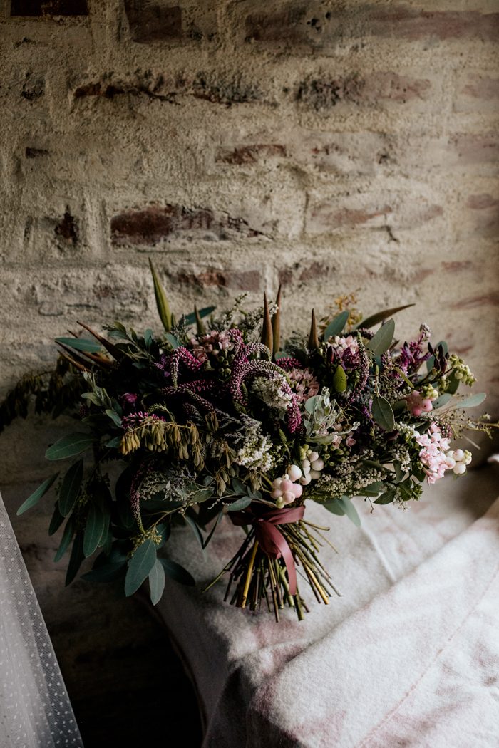 The lush wildflower bouquet looked crazy and very bold, it was perfectly matching the wedding theme