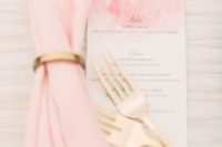 06 a pink watercolor menu with gold flatware plus a pink napkin and a gold napkin ring