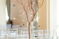 07 branches with little paper cranes for decorating a contemporary ceremony space